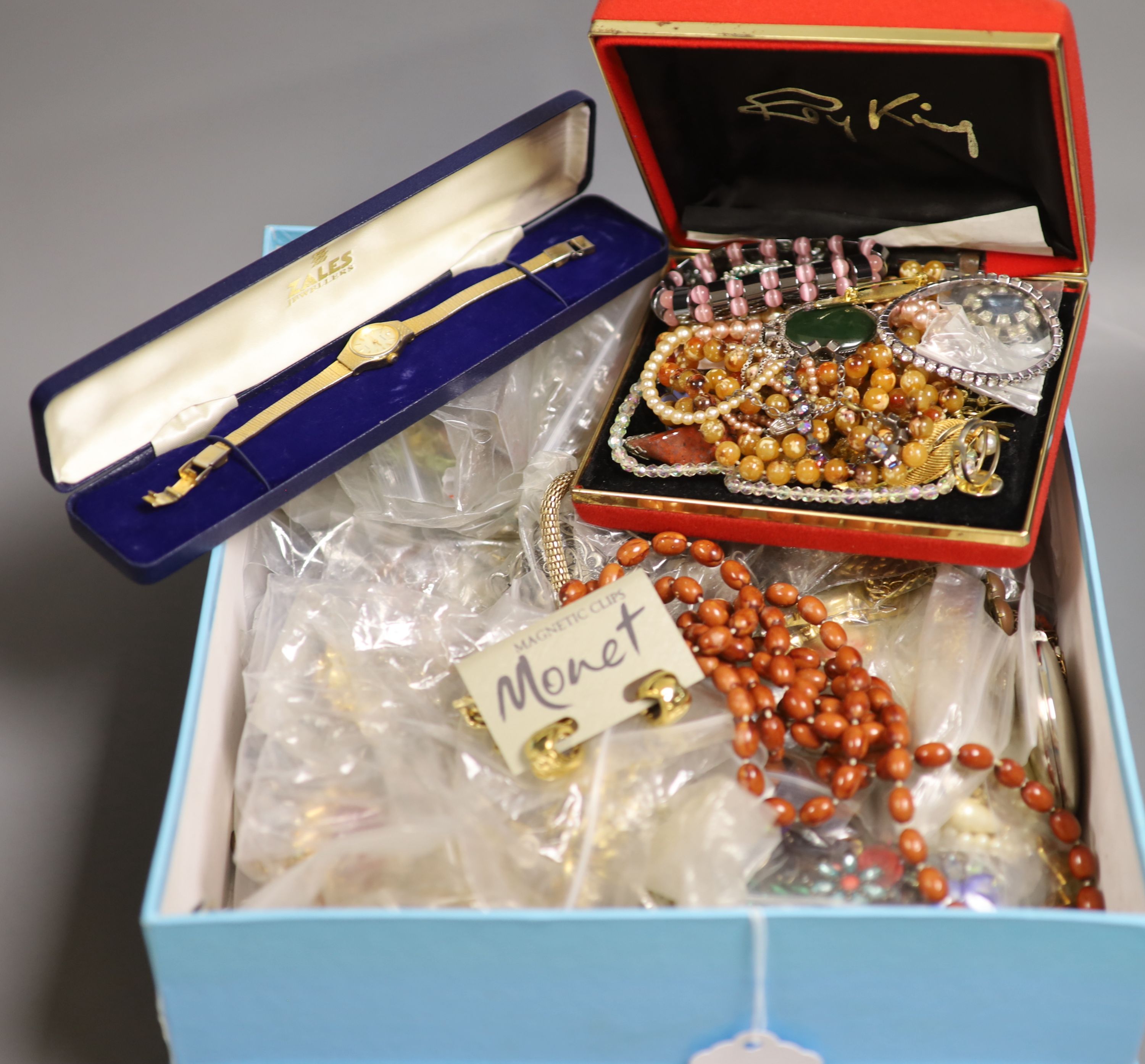 A box of assorted costume jewellery.